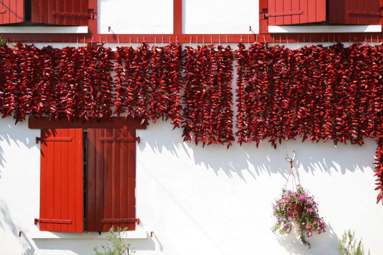 Photo of piments d'Espelette put out to dry outside a house.
