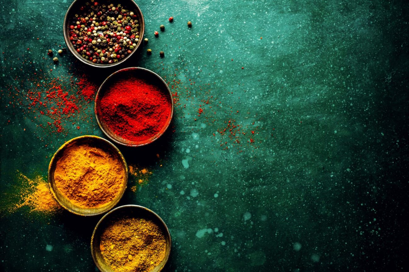 Image of spices illustrates blog "Today we pay homage to paprika, one of the world’s most iconic spices. Keep reading to learn more about this distinguished member of your spice cabinet."