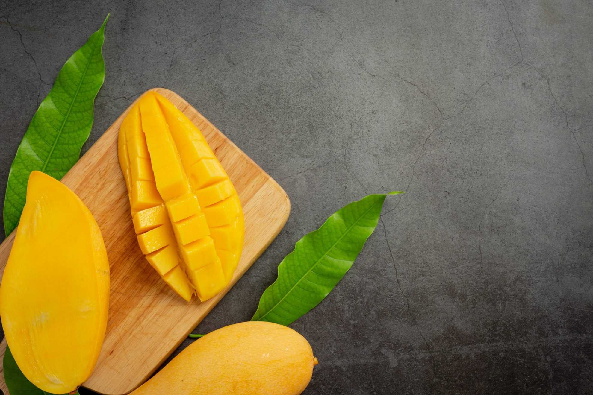 Photo of mango on a chopping board illustrates blog "Some Interesting Facts About Mango"