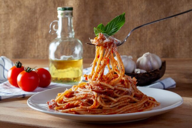 Photo of fork lifting spaghetti from a plate illustrates blog: "How to Choose the Right Type of Pasta"