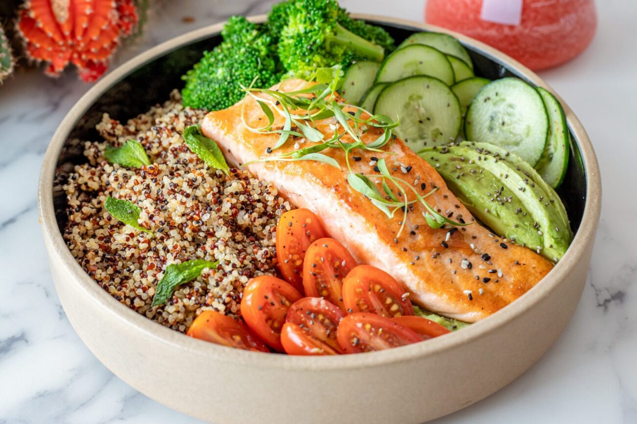Plate of quinoa with salmon illustrates blog: "Can You Freeze Quinoa?"
