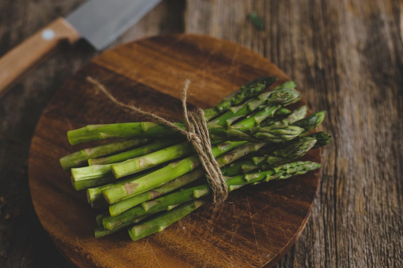 Photo of asparagus on chopping board illustrates blog: "When Is Asparagus in Season?"