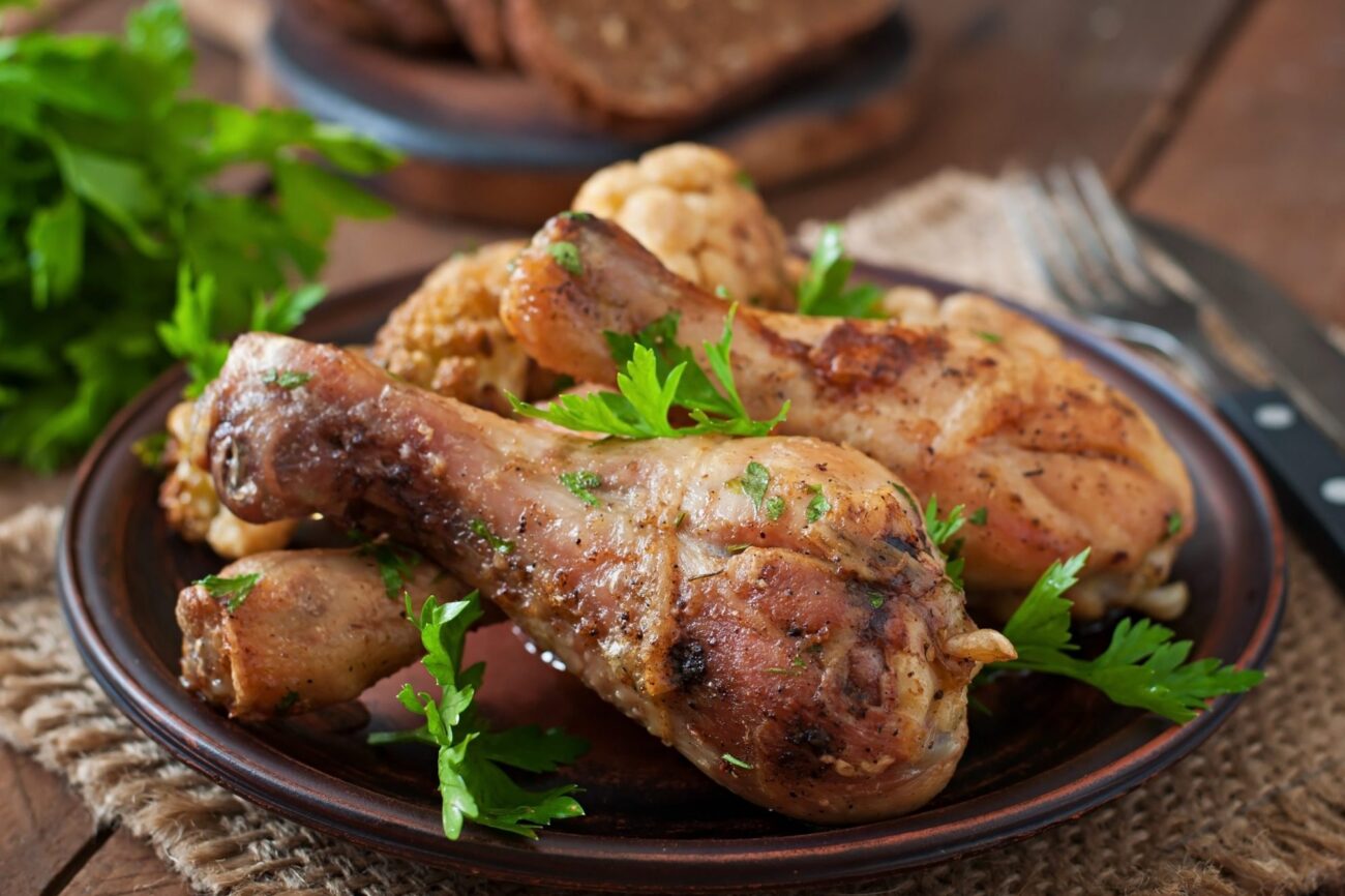 Photo of chicken leg with herbs illustrates blog: "Grilled Chicken: 3 Yummy Tips"