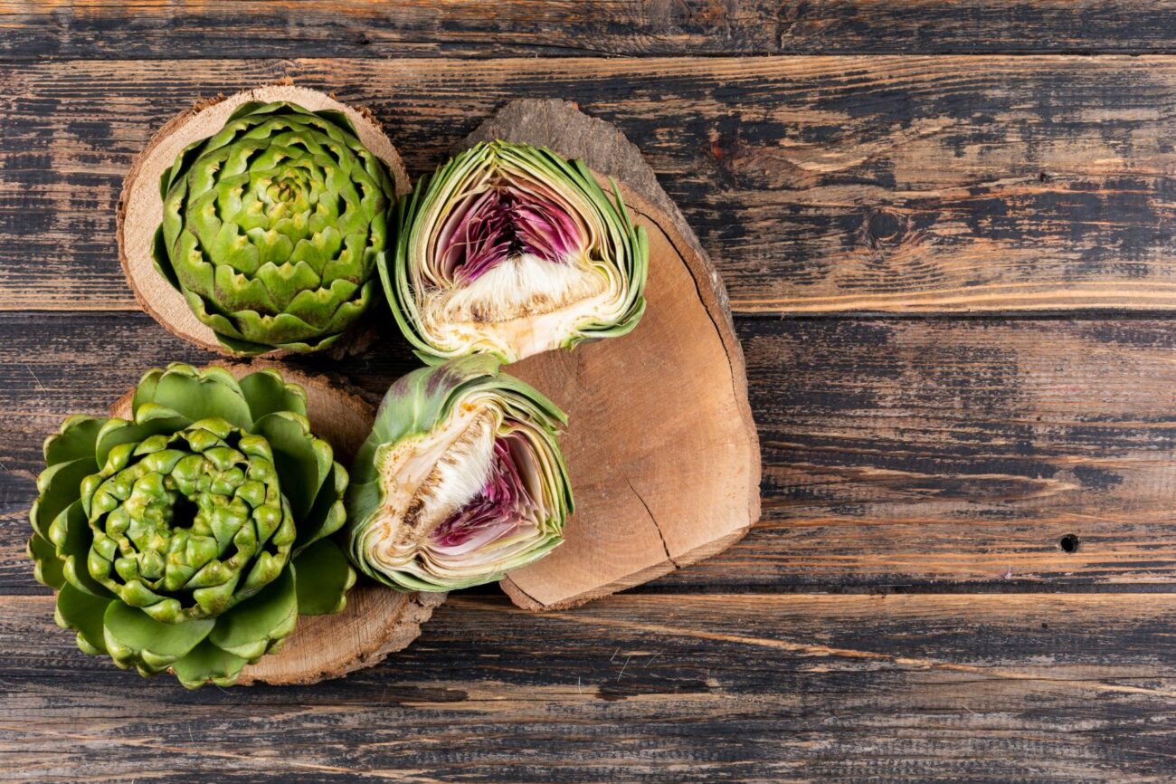 Photo of artichokes on cutting board illustrates blog: "When Are Artichokes in Season?"