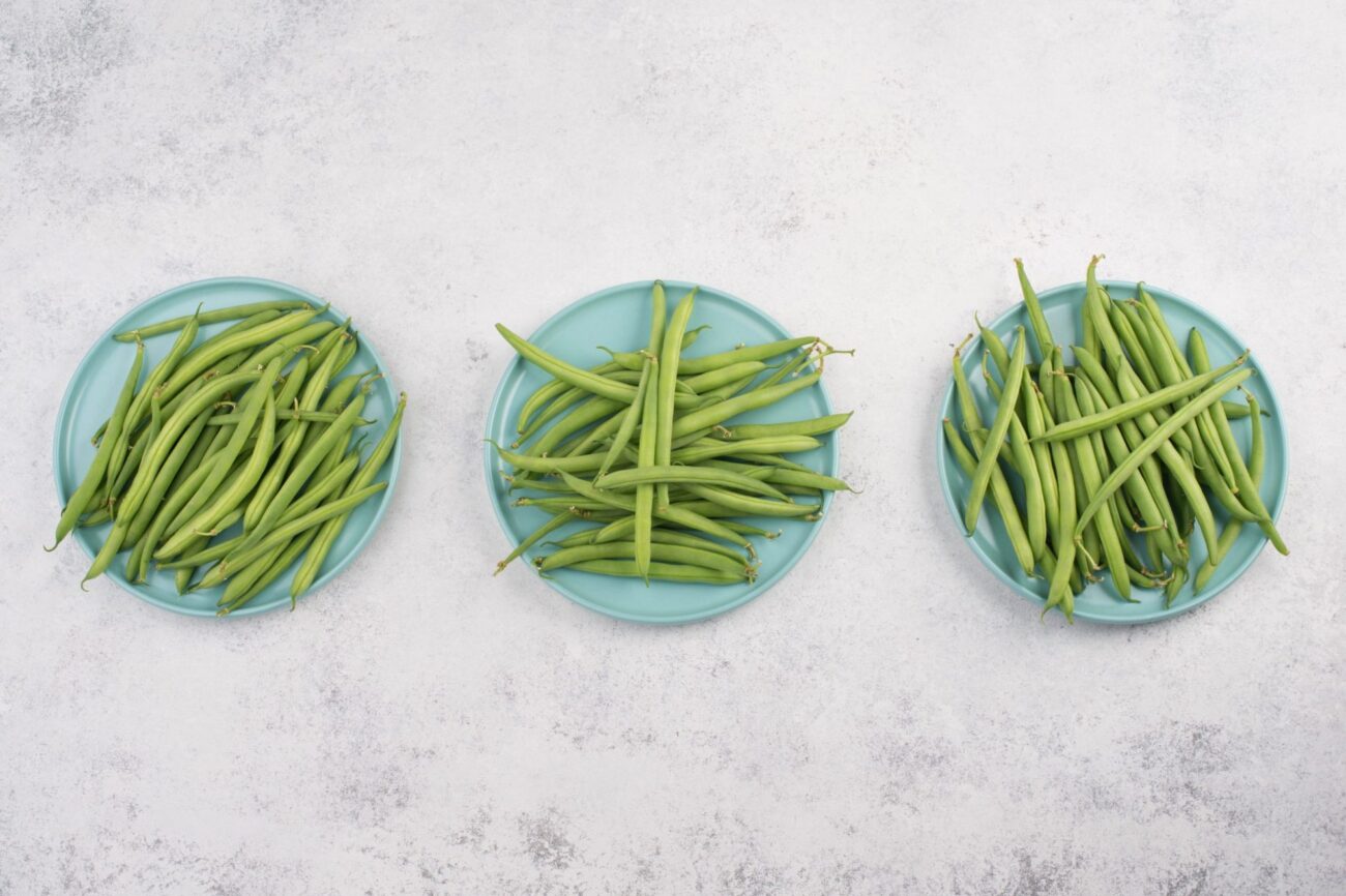 Photo of three plates with green beans seen from above illustrattes blog: "Are Green Beans Good for You? Some Nutrition Facts"