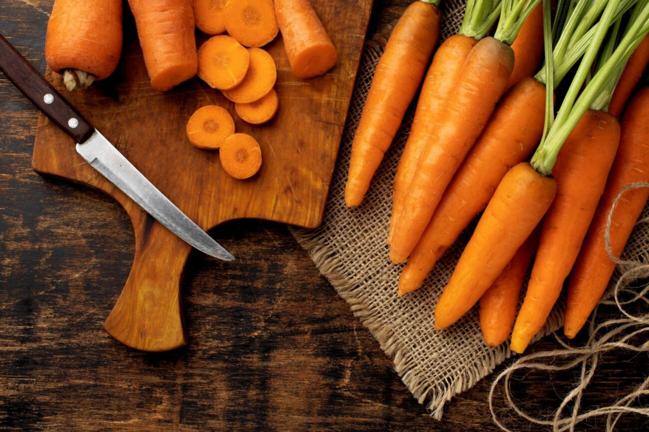 Photo of carrots on chopping block illustrates blog: "Why Are Carrots Orange?"