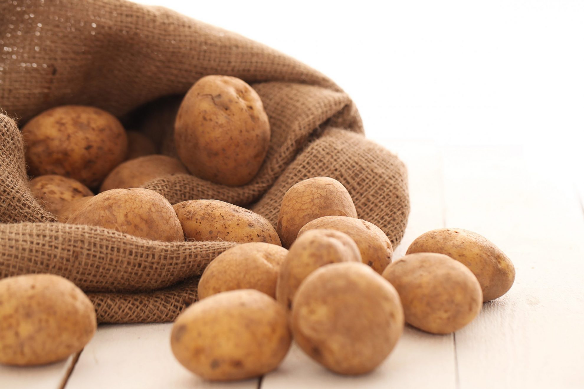 Photo of unpeeled potatoes illustrates blog: "Can Potatoes Go Bad?"