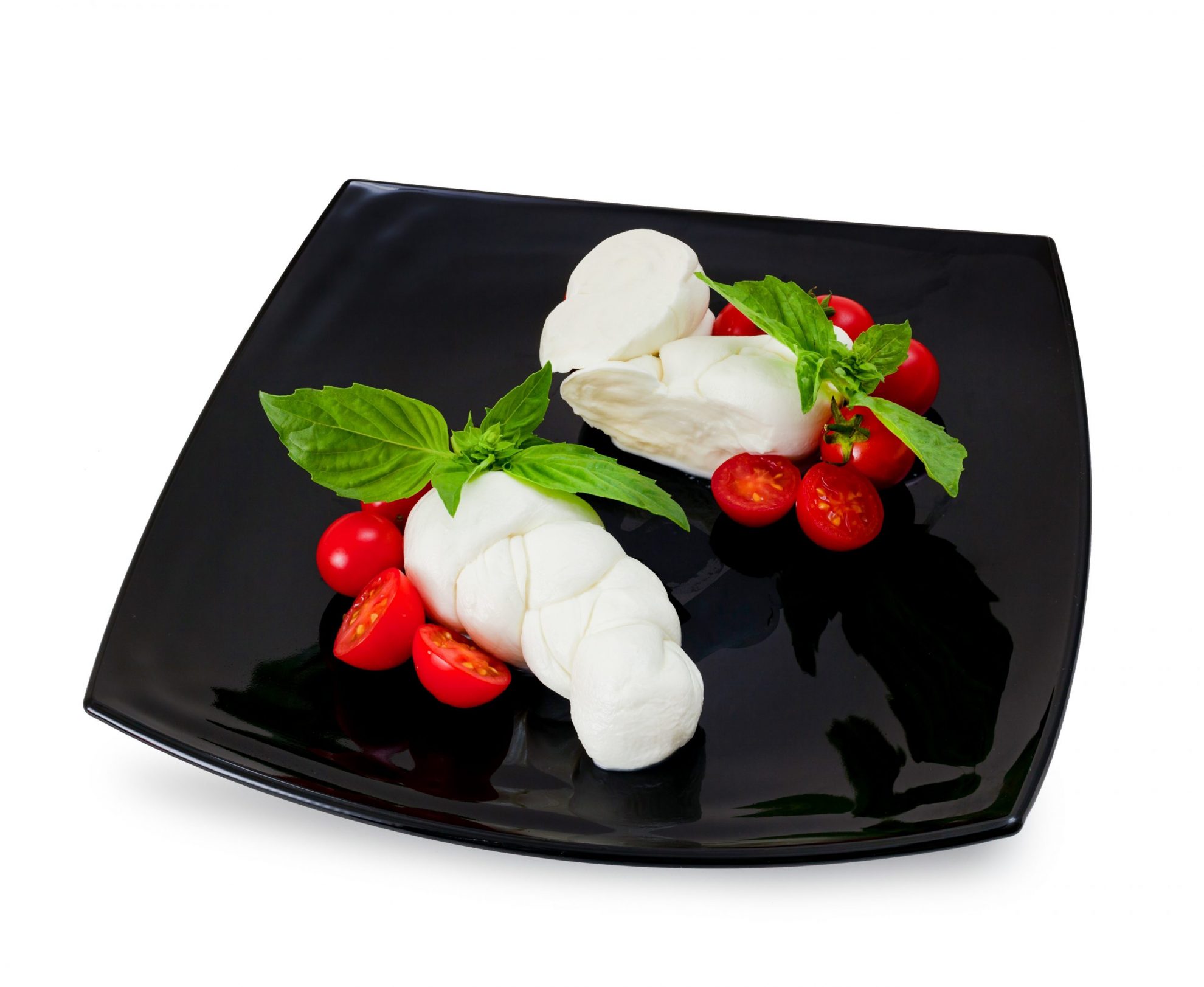 Plate with mozzarella and cherry tomatoes illustrates blog: "Is Mozzarella Made From Cow’s or Goat’s Milk?"