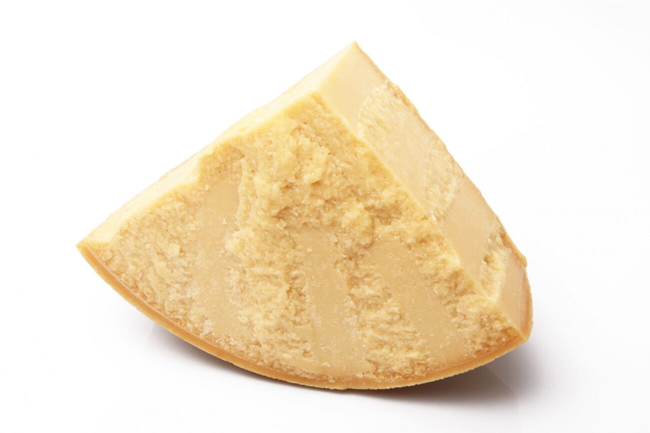original italian parmesan cheese in white background Wedge of Parmesan cheese.