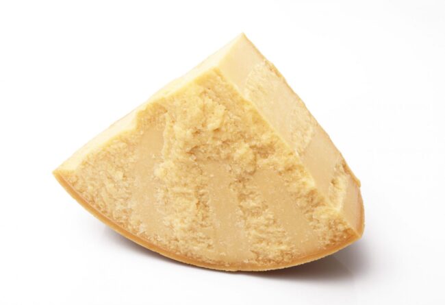 original italian parmesan cheese in white background Wedge of Parmesan cheese.