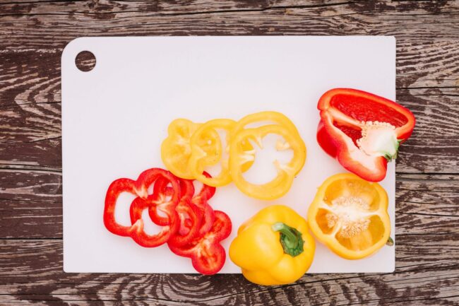 BellPeppers2 Bell peppers on cutting board illustrate blog "Can Bell Peppers Be Spicy?"
