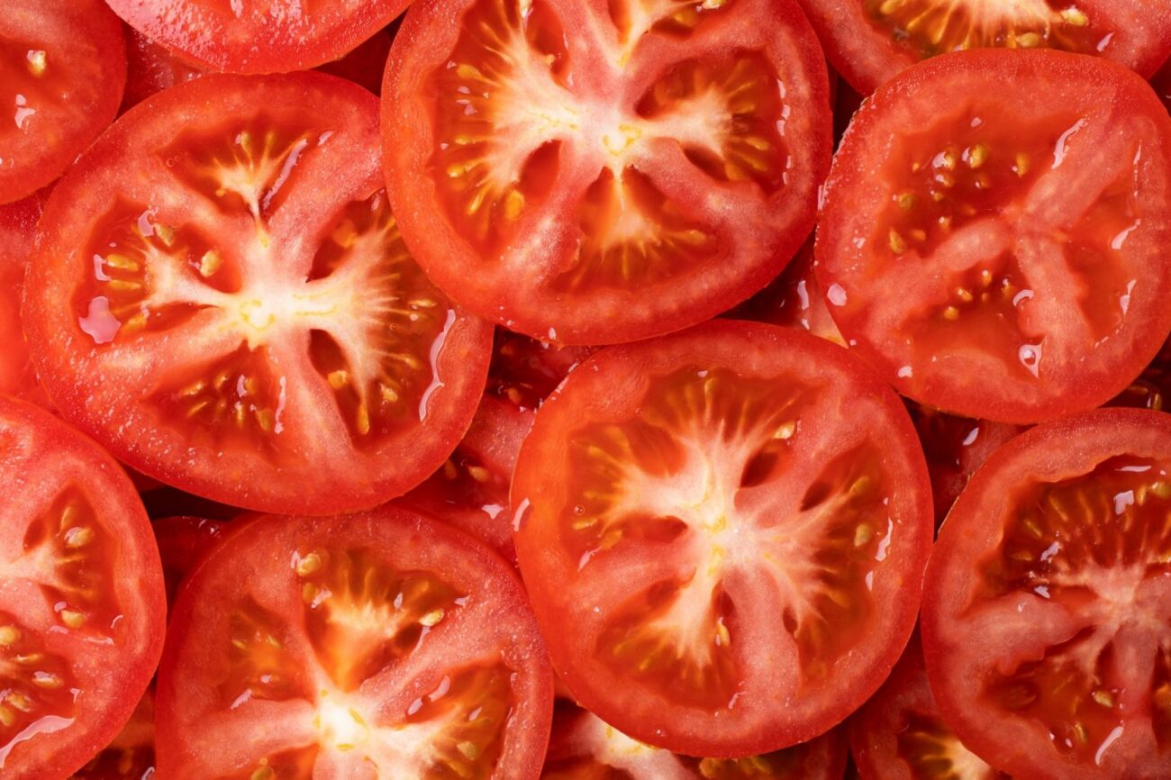 Photo of sliced tomatoes illustrates blog "Tomato vs Tomatillo: What Is the Difference?"
