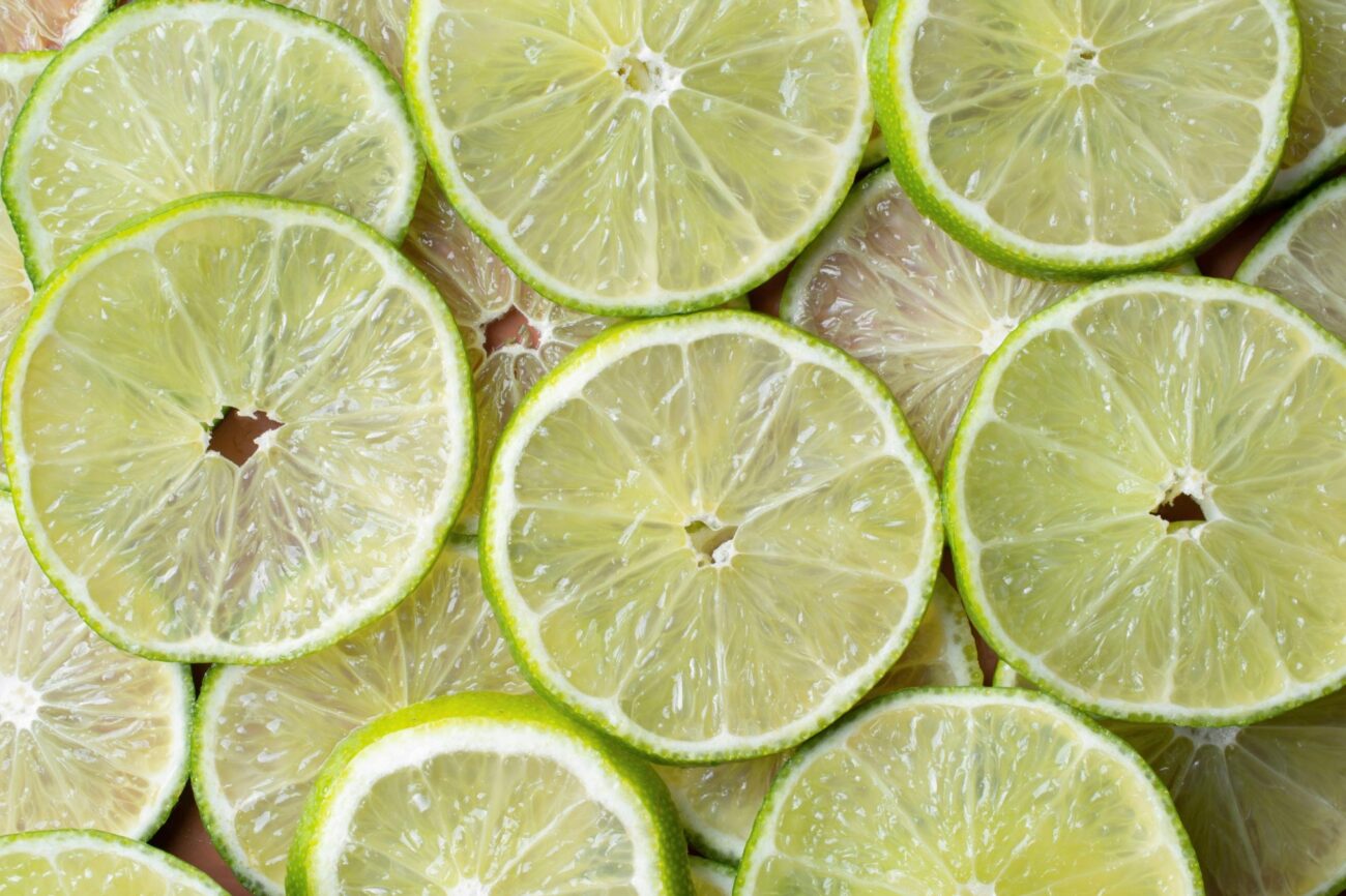 Limes cut in slices illustrate blog "Lemon vs Lime: What Is the Difference?"