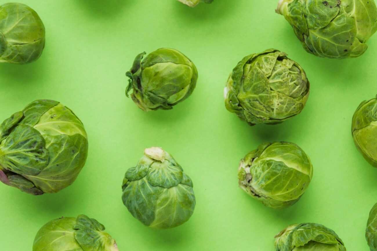 Brussels sprouts against green background.