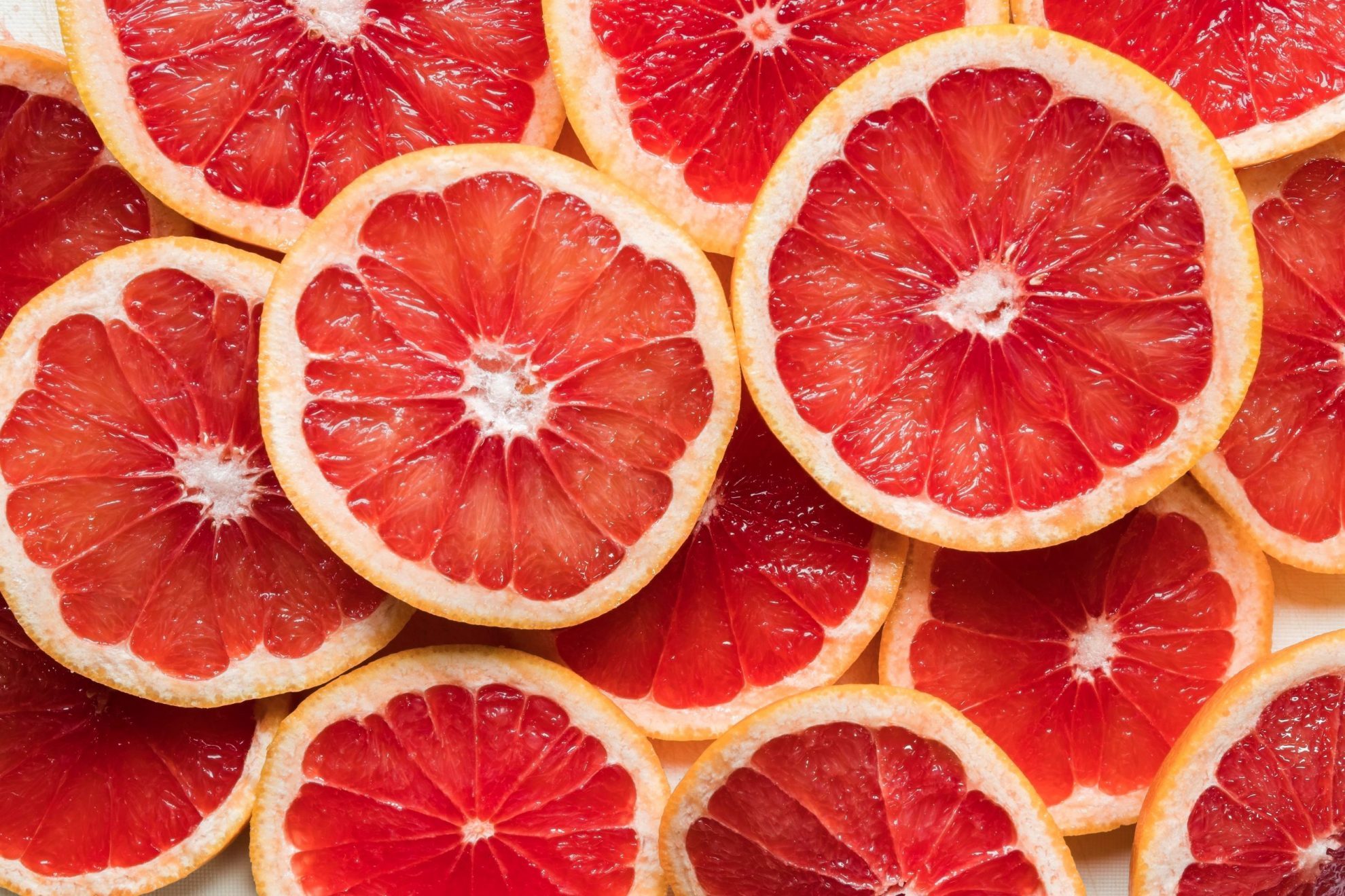 Closeup of grapefruit slices illustrates blog "Where Did Grapefruit Originate?"