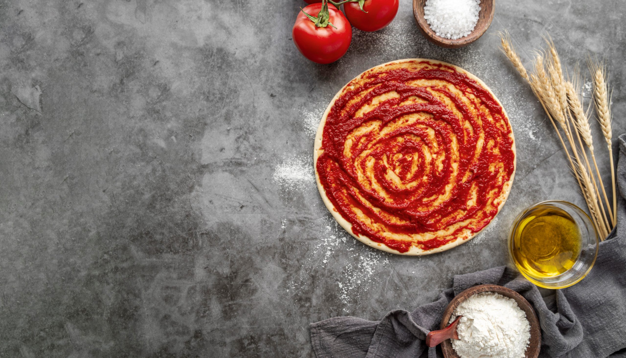 Photo of pizza pie with sauce illustrates blog "Can You Use Pizza Sauce for Pasta?"