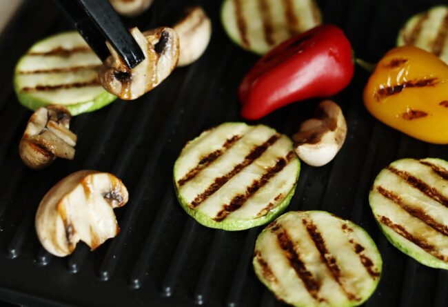 Grilled vegetables Closeup of person grilling vegeables.