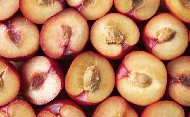 peaches-almonds-fp Peaches cut in half illustrate blog "Are Almonds Part of the Peach Family?"