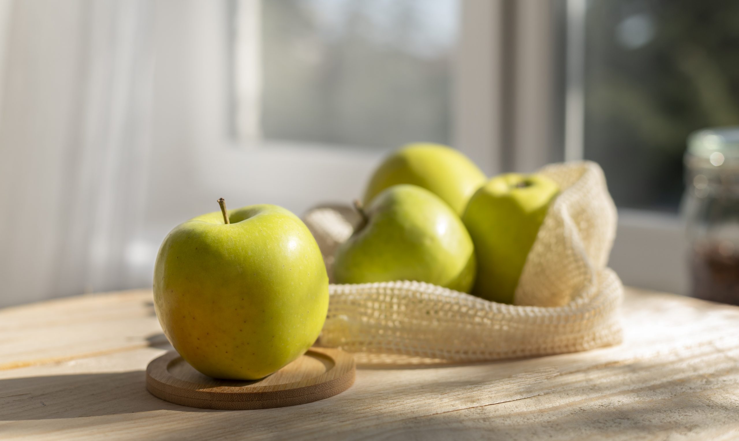 apples-fp Apples on kitchen counter illustrate blog "Apples are one of the most popular fruits consumed around the world. They are known for their sweet taste, crunch, and numerous health benefits. But have you ever wondered if apples contain acid? In this blog post, we will explore whether apples have acid, the types of acid present in apples, and whether this acid is harmful to our health or not."
