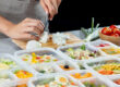 Chef preparing healthy corporate meal prep for shift workers