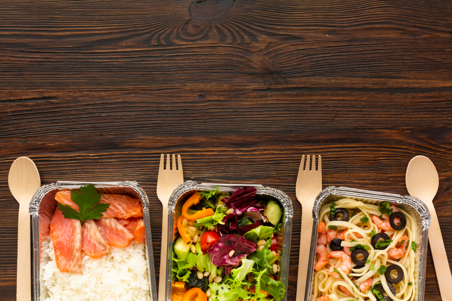 Chef-prepared meals displayed beside packaged office food in a workplace setting
